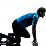 one caucasian man runner sprinter on starting blocks  in silhoue